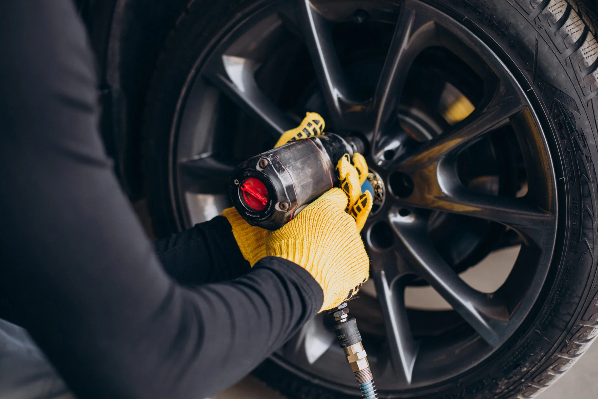 car mechanic changing wheels car